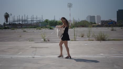 woman walking in an urban parking lot
