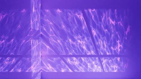 serenity in purple: light patterns on a pool’s surface vertical