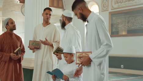 Islam,-men-and-child-with-Quran-in-mosque