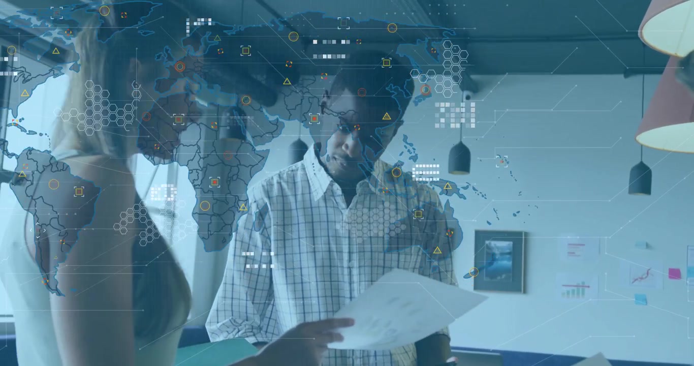 Female handing report to male colleague in office with world map and icons guiding business review