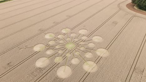 drone dolly tilt-down over enigmatic crop circle in english countryside