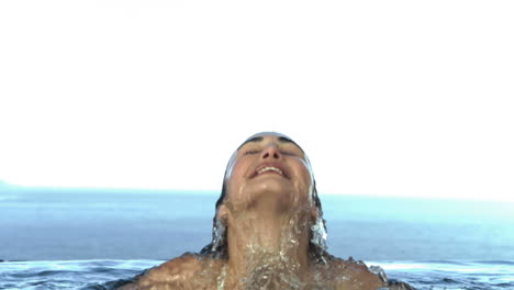 woman getting out of the water in slow motion