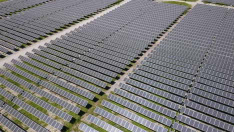 amazing birds eye view of solar energy power plant reveals hundreds of panels producing clean green renewable energy to save the earth