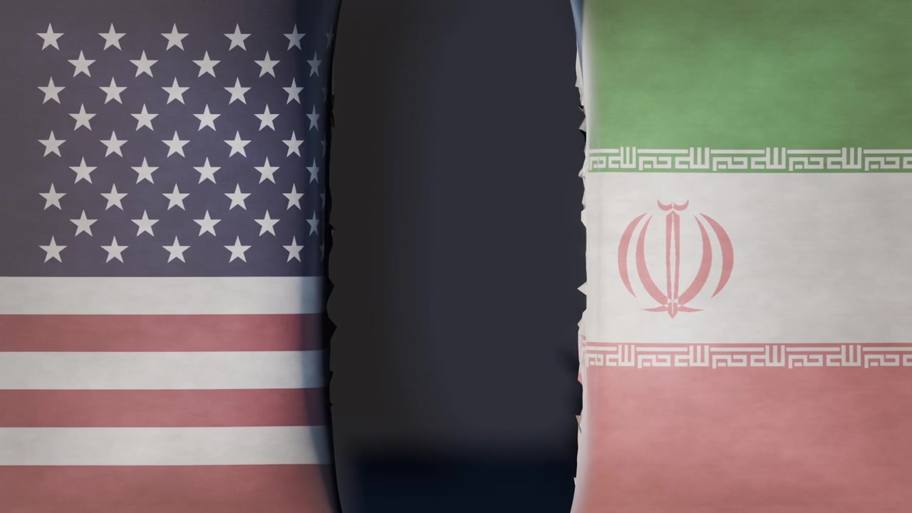 Center darkening appearing, US and Iran flags ripping open over studio graphic, exposing black void