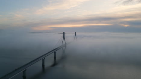 epic cinematic shot of beautiful bridge above cold still water in amazing landscape in northern finland, europe architectural