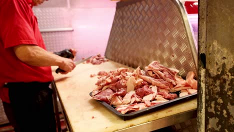 butcher slicing meat at melbourne market