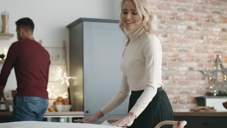 Couple-preparing-home-for-Christmas-Eve