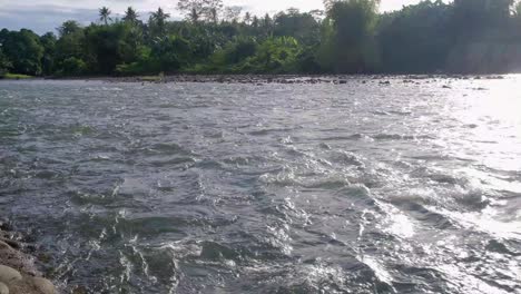 sparkling lake with flowing waters and sunlight reflections