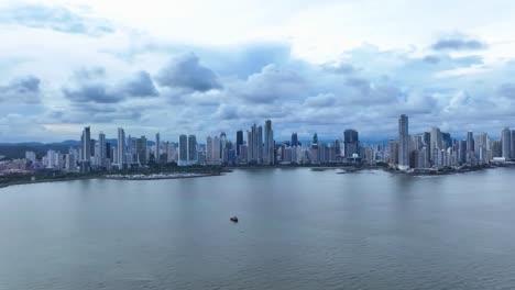 panama city, panama wide shot over bay with clouds. drone dolly right to left hd