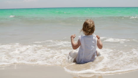 cute little girl enjoying the sea