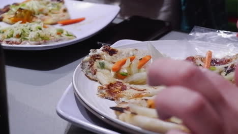 close-up: people enjoy eating tasty pupusas in san salvador restaurant