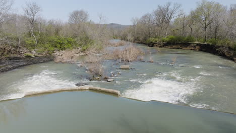 slow motion dolly over a concrete dam downstream of west fork white river pump station