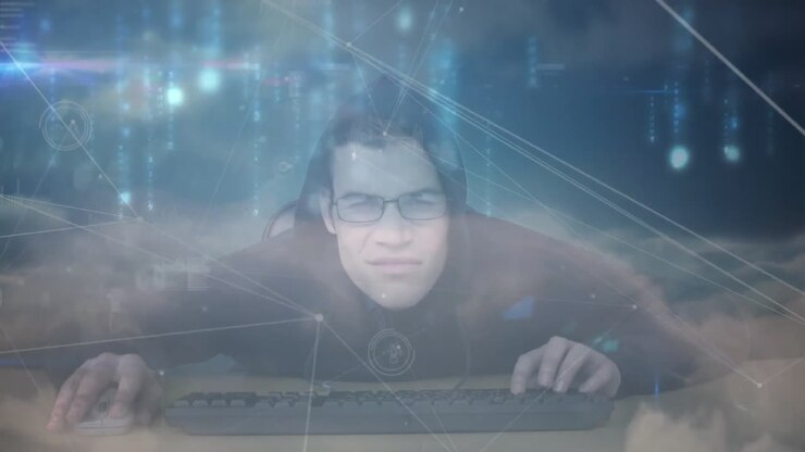 Man typing at desk in technology lab, featuring animated cloud visuals and glowing code streams