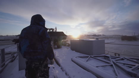 winter cargo loading operation on frozen river
