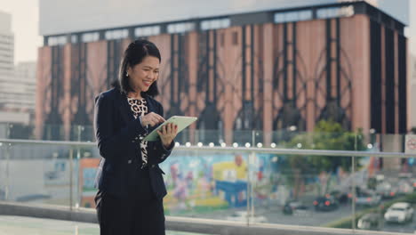 businesswoman using a tablet in the city