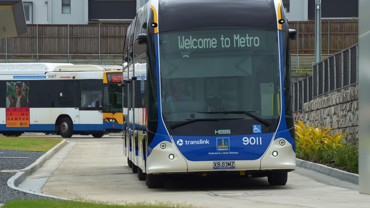 Turn-up-and-go Brisbane Metro Bus driving around the depot, an innovative bus rapid transit system in Queensland.
