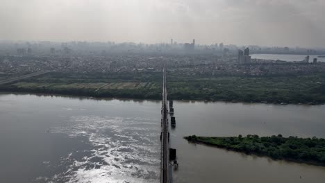 impressive long bien bridge in hanoi impacted by air polluted backdrop