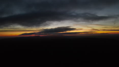 drone flying near clouds at sunset in south wales
