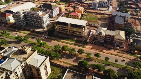jib down of the urban area of abuja, nigeria. traffic drives over a long road located in the capital of the african nation
