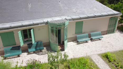 view of maison de balzac with benches and door gate