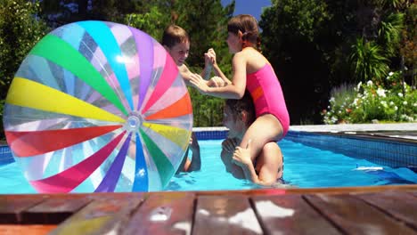 happy family having fun in swimming pool