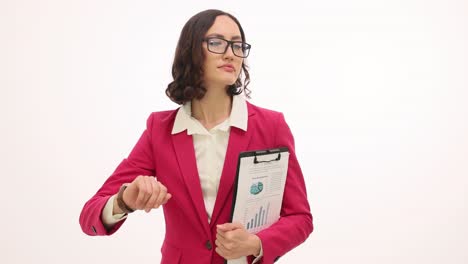 professional woman checking time while holding business report