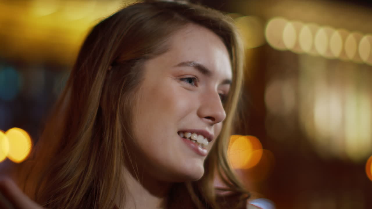 Portrait of beautiful girl having video call by mobile phone outdoors