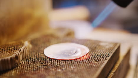 Close-Up-Of-Female-Jeweller-Working-On-Piece-In-Studio-Using-Blowtorch