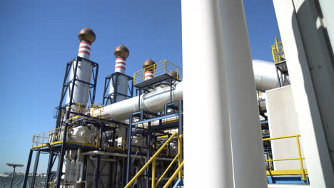 smoke-free chimneys against a blue sky