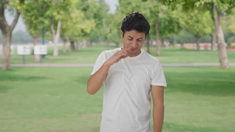 indian man smelling something bad