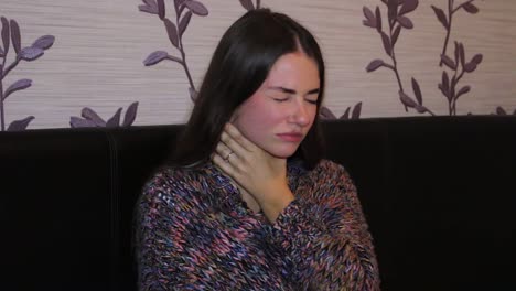 teenage girl with sore throat coughing