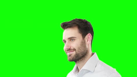 Smiling-man-standing-against-green-screen