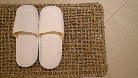 white slipper in hotel bedroom