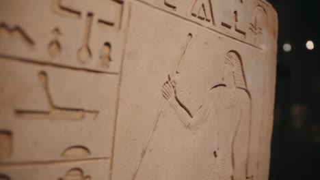 close up of egyptian hieroglyphics, antique alphabet script in archaeology site, history background