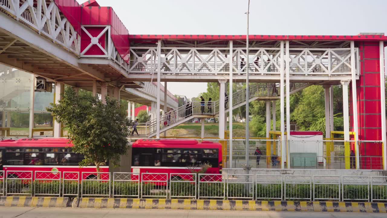 Scenic Cityscape of Metro Bus Station with Overhead Bridge, Featuring Urban Infrastructure, Transportation and City Life in Harmony