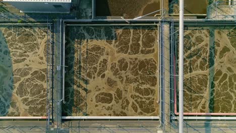 aerial close-up footage of the intricate processes at a wastewater treatment facility