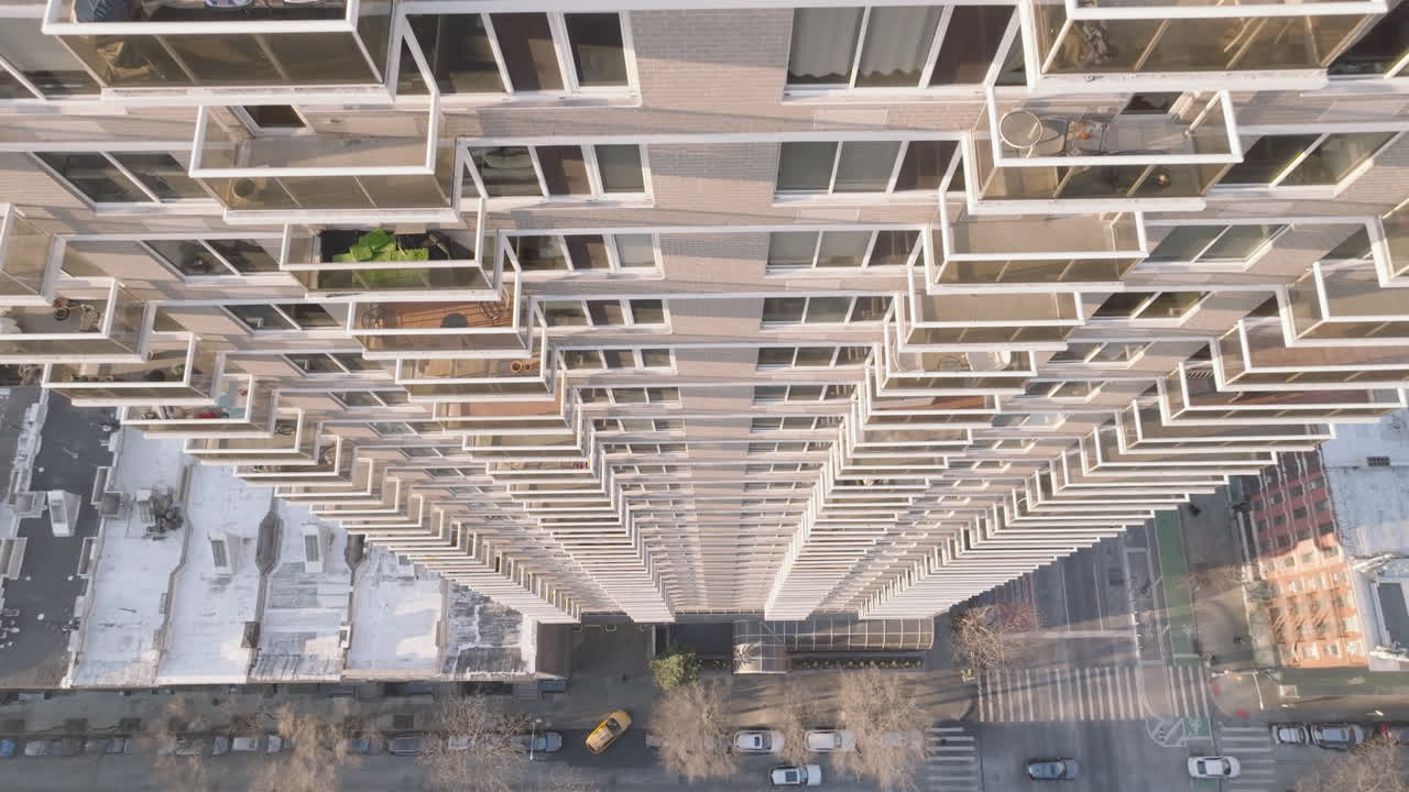 Drone point of view of an apartment building in New York City. Shot at sunrise during the winter on Manhattan’s Upper East Side.