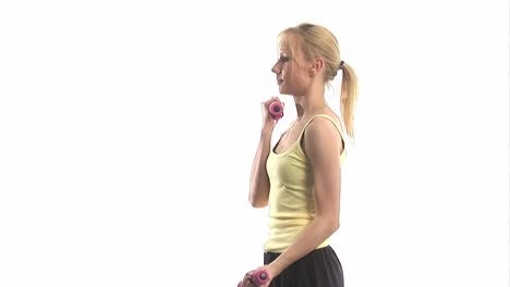 Young-woman-exercising-with-dumbells