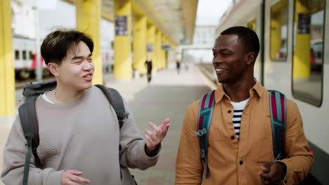 friends walking at the train station