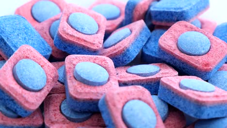 colorful dishwashing granules rotate in a circle detergents for the dishwasher