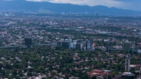 drone film of mexico city's west side on a clear, bustling day