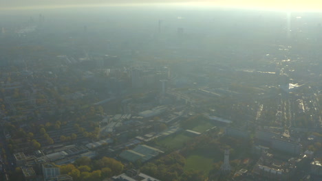 High-aerial-shot-over-hazy-north-London-towards-city-centre