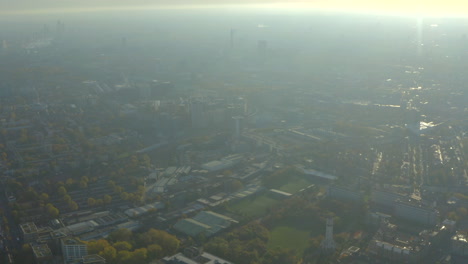 high aerial shot over hazy north london towards city centre