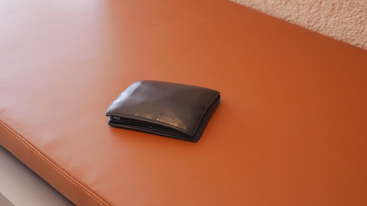 Leather Wallet on a Brown Surface