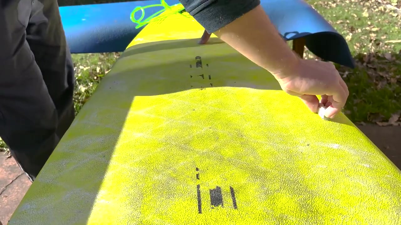 Caucasian man hands waxing the surfboard. Lifestyle water sports. Adventure
