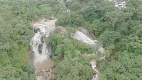 aerial - waterfalls, cascades at jos plateau, nigeria, reverse rising reveal shot