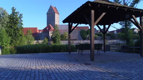 a drone rises along the gazebo on the shore of the lake has a beautiful view of the lake and the ancient city