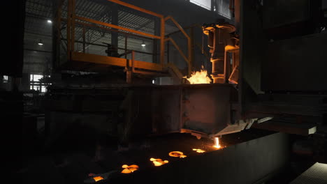 casting molten steel into molds in the ironworks