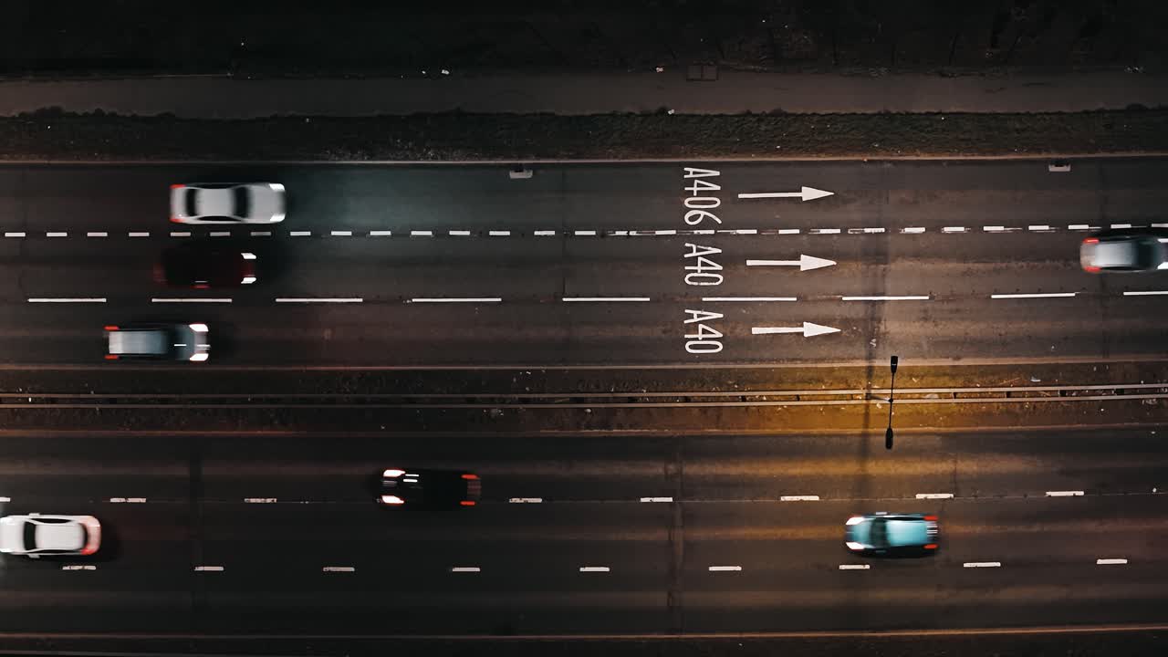 Busy A40 road at night, West London traffic commute, aerial view