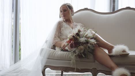 Bride-laughed-and-she-relaxes-on-couch